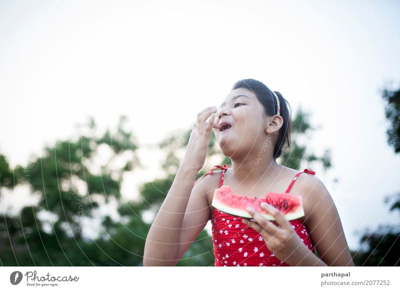 Girl eating watermelon and making fun Food Nutrition Eating Lifestyle Joy Healthy Healthy Eating 1 Human being 8 - 13 years Child Infancy Red Happiness Summer