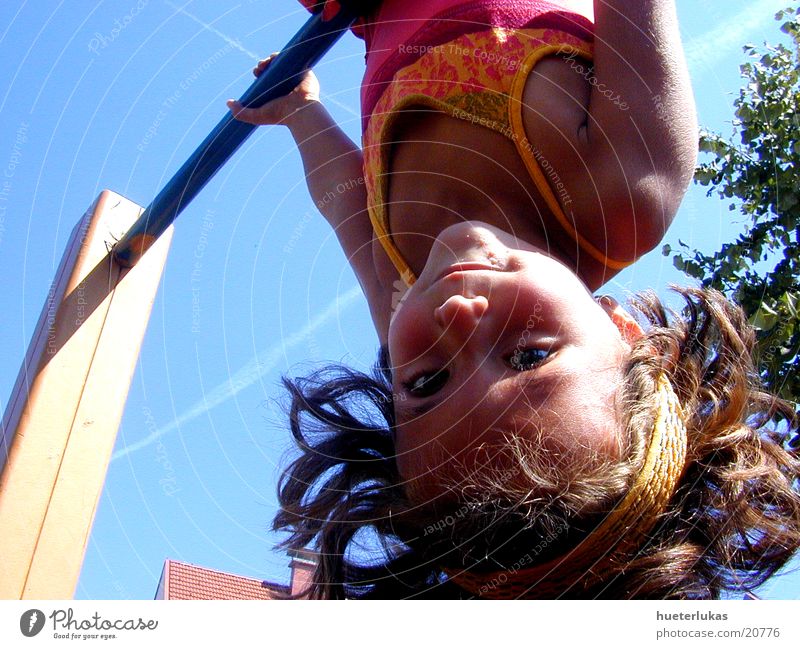 the world is upside down Child Playing Playground Inverted Dangerous Blue sky Joy happy Speed