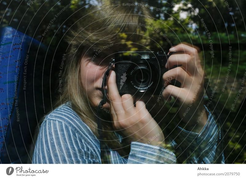 A young woman explores the world with her camera Feminine Young woman Youth (Young adults) Adults Life 1 Human being Camera Observe Discover To hold on
