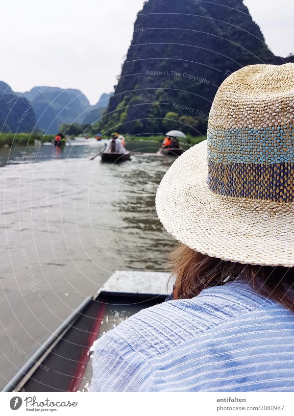 A sun hat is an advantage Joy Vacation & Travel Tourism Trip Adventure Far-off places Freedom Sightseeing Boating trip Rowboat Feminine Woman Adults Life Head