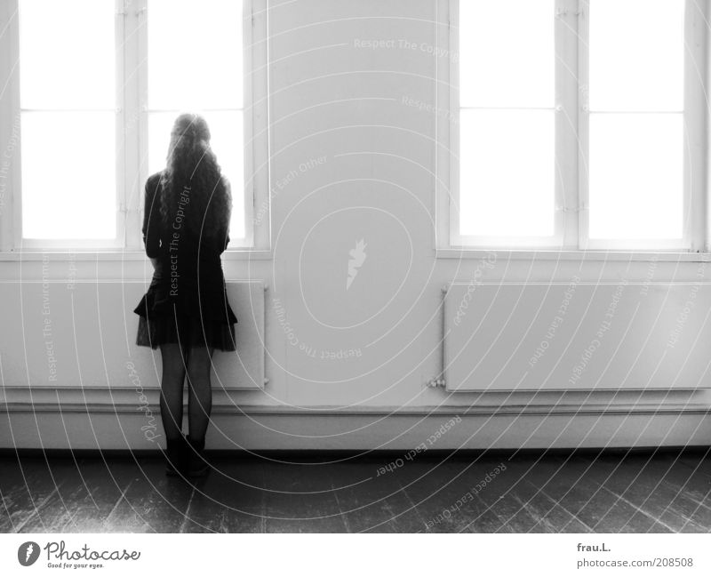 time windows Human being Young woman Youth (Young adults) 1 Window Skirt Boots Long-haired Observe Looking Stand Wait Expectation Time Black & white photo
