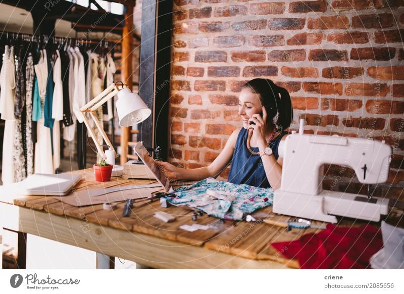 Young businesswoman speaking to customer on the phone Lifestyle Joy Desk Work and employment Profession Office Telecommunications Business SME Career To talk