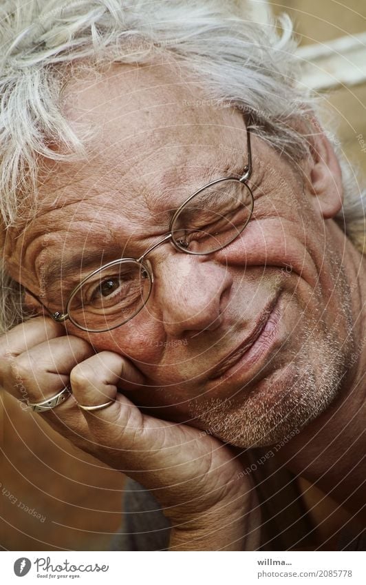 Sympathetically mischievous portrait of an interesting man Man Wink Eyeglasses Face White-haired Designer stubble Smiling Funny Impish Congenial Attractive