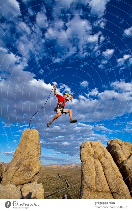 Climber jumping across gap. Life Adventure Climbing Mountaineering Rope Man Adults 1 Human being 30 - 45 years Rock Peak Flying Jump Athletic Tall Bravery