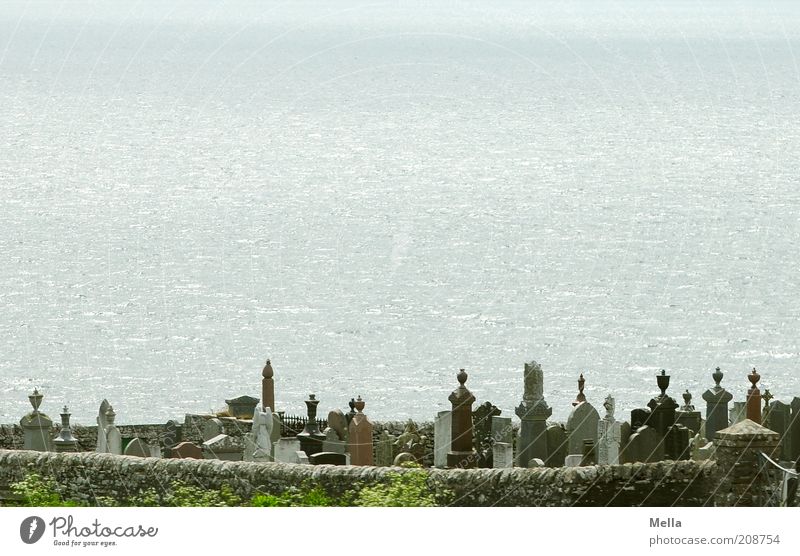 Room with a view Environment Coast Ocean Cemetery Wall (barrier) Wall (building) Tombstone Grave Stone Exceptional Emotions Moody Belief Sadness Grief Death