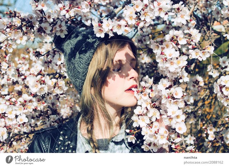 Young woman posing with a lot of almond flowers Lifestyle Style Wellness Well-being Senses Relaxation Human being Feminine Youth (Young adults) 1 18 - 30 years