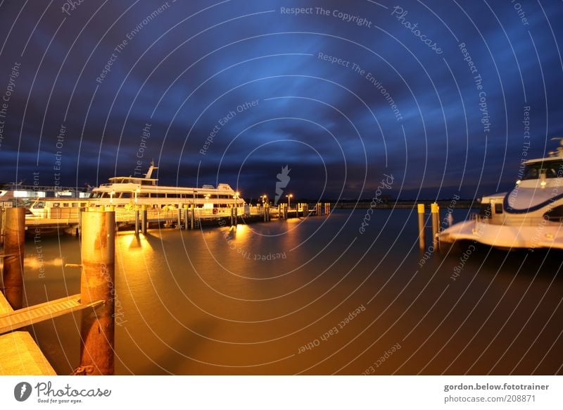 12 o'clock at night Sky Clouds Night sky Lake Lake Constance Means of transport Navigation Boating trip Passenger ship Harbour Blue Gold Colour photo