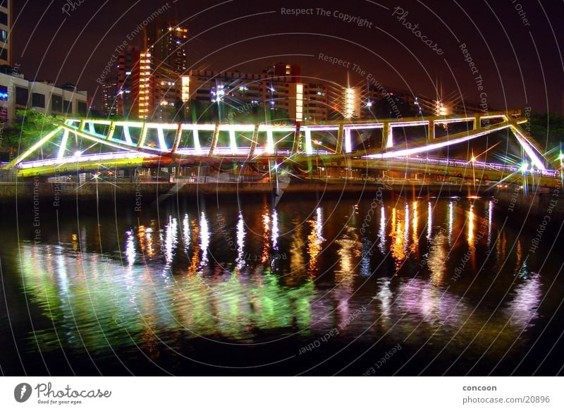 The bridge at... (9915km away from Germany) Steel Multicoloured Evening Physics Thailand Singapore Architecture Bridge Colour River spieglung Warmth