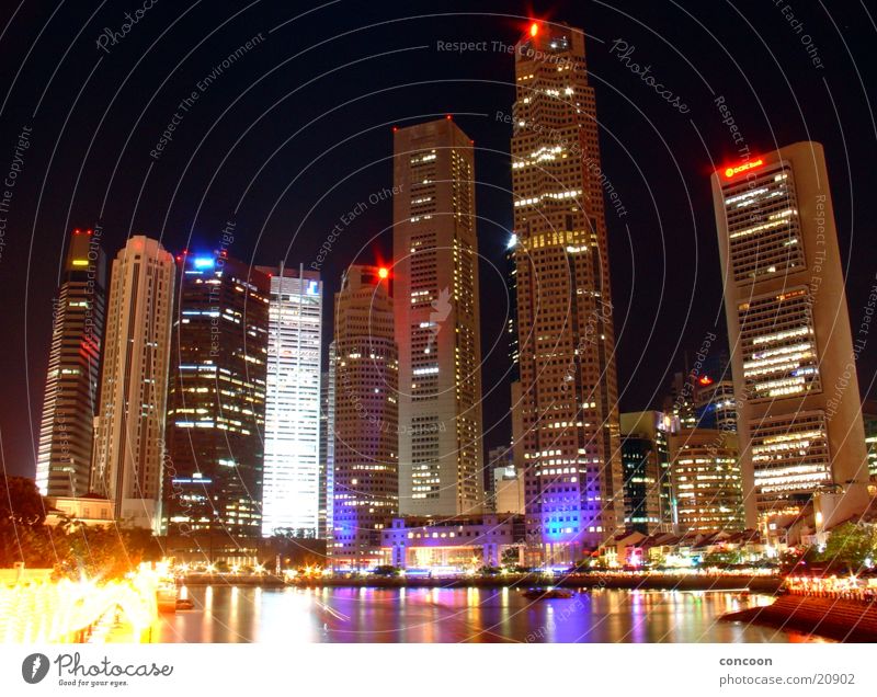 The colourful skyscrapers of Singapore High-rise Multicoloured Modern architecture Thailand Los Angeles Skyline Glass night lighting Light Architecture Town