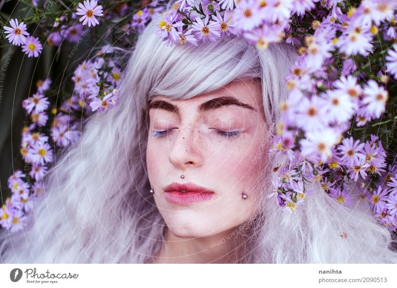 Artistic young woman portrait with a lot of purple flowers Feminine Youth (Young adults) 1 Human being 18 - 30 years Adults Environment Nature Plant Flower