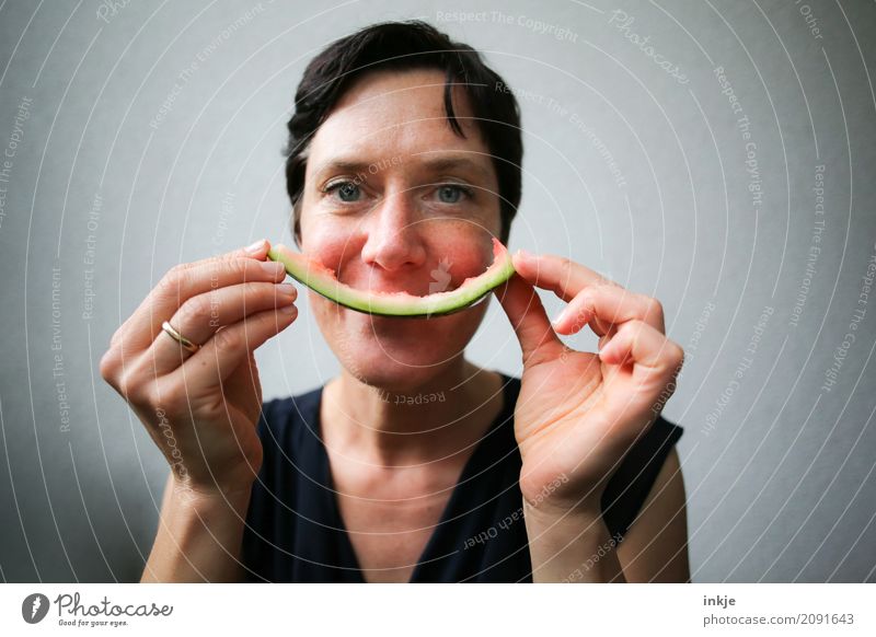 not so young caucasian smiling woman with rest of watermelon Fruit Water melon Melon Sheath Nutrition Eating Organic produce Vegetarian diet Finger food Woman