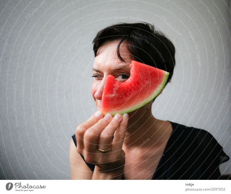 funny happy caucasian woman looking through watermelon Fruit Melon Water melon Nutrition Eating Organic produce Vegetarian diet Finger food Lifestyle Joy Woman