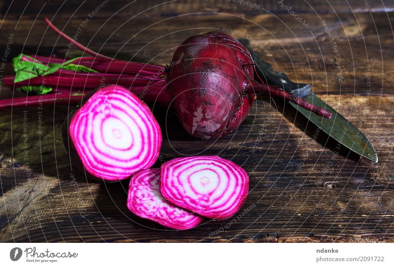 Raw red beets are cut into pieces Vegetable Eating Vegetarian diet Nature Wood Fresh Natural Brown Red agriculture background Red beet bulb cooking Edible food