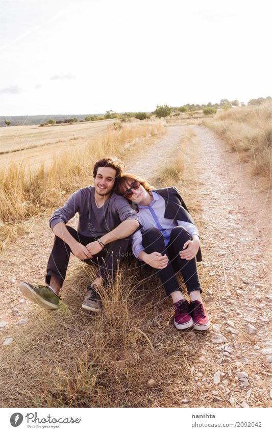 Young couple sitting together in a rural path Lifestyle Style Wellness Well-being Relaxation Human being Masculine Feminine Young woman Youth (Young adults)