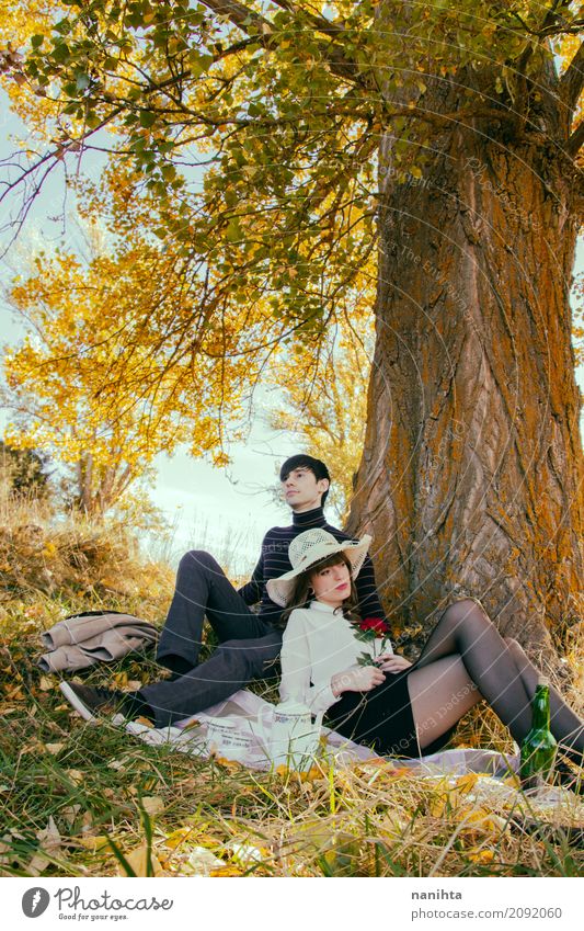 Young couple having a romantic date in a park Lifestyle Elegant Style Wellness Relaxation Vacation & Travel Tourism Masculine Feminine Young woman