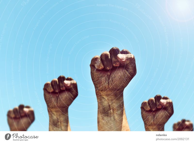 Male hands are clenched into a fist Freedom Sun Human being Man Adults Hand Fingers Group Sky Old Aggression Dirty Retro Strong Blue Black Power Might