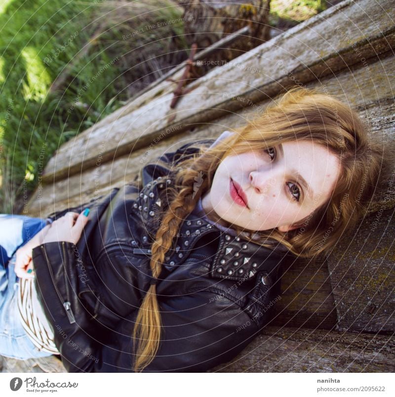 Young modern woman lying on a old wood door Lifestyle Style Hair and hairstyles Wellness Well-being Relaxation Human being Feminine Young man