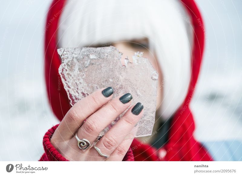 Young woman holding a piece of ice Nail polish Human being Feminine Young man Youth (Young adults) 1 18 - 30 years Adults Nature Winter Climate Weather Ice