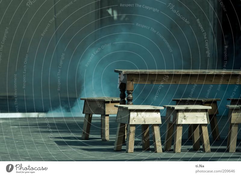 sound and smoke Art Stage play Smoke Blue Gray Table Chair Wooden table Wooden chair Asphalt Shadow Sunlight Medieval times Colour photo Subdued colour