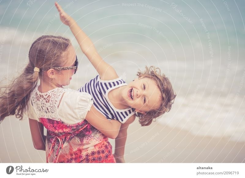 Sister and brother playing on the beach Lifestyle Joy Happy Beautiful Relaxation Leisure and hobbies Playing Vacation & Travel Freedom Summer Sun Beach Ocean