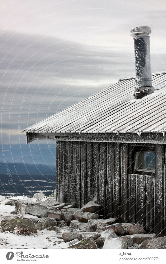 frozen landscape Clouds Winter Bad weather Ice Frost Snow Rock Mountain Deserted Hut Wall (barrier) Wall (building) Roof Chimney Line Stripe Freeze Authentic