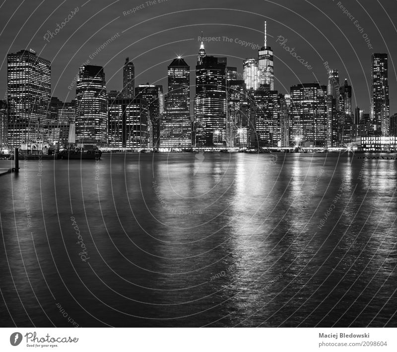 Manhattan skyline reflected in East River at night Vacation & Travel Office Business Downtown Skyline High-rise Bank building Building Architecture Black White