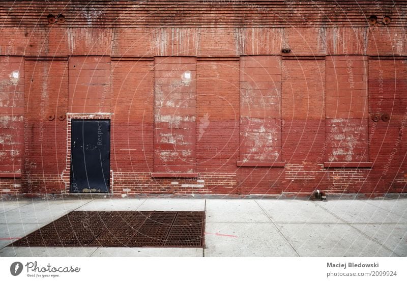 Empty street with old warehouse brick wall. Town Deserted Factory Building Architecture Facade Street Old Dirty Red Moody background New York City Brooklyn