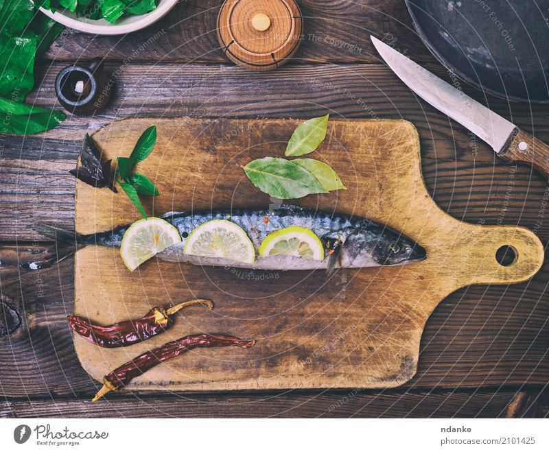 mackerel on a wooden kitchen board Fish Seafood Herbs and spices Nutrition Lunch Dinner Diet Pan Knives Ocean Table Kitchen Restaurant Gastronomy Animal Wood