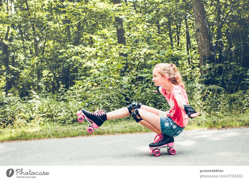 Young girl roller skating down on a forest road on summer day Lifestyle Joy Happy Relaxation Vacation & Travel Freedom Summer Sports Child Human being Girl