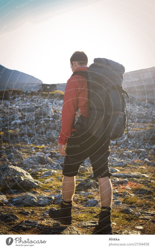 Portrait of a young man with a hiking backpack, Norway Vacation & Travel Adventure Freedom Hiking Young man Youth (Young adults) Nature Rock Hut Wild