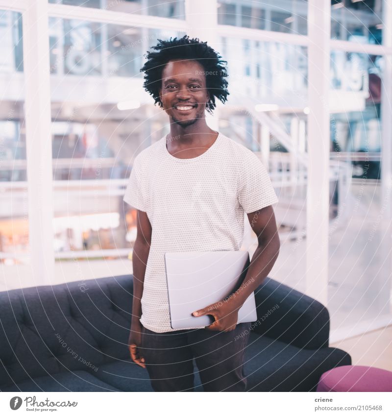 Portrait of young african businessman in the office Lifestyle Joy Work and employment Profession Workplace Office Business SME Career Success Notebook