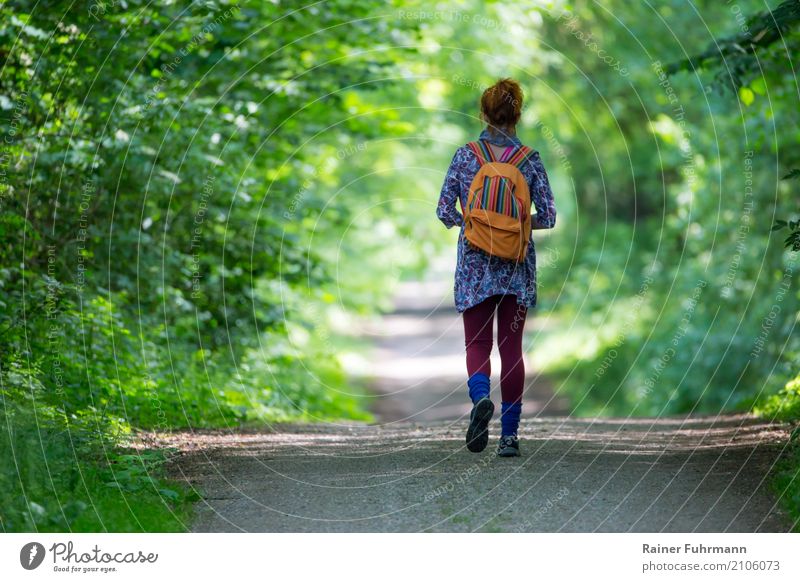 a woman goes her way alone Human being Feminine Woman Adults 1 Nature Landscape Spring Summer Forest Lanes & trails Going Walking Vacation & Travel Hiking