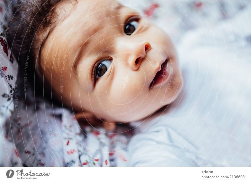 Close-up of little toddler boy looking in camera Lifestyle Joy Skin Well-being Living or residing Bed Children's room Bedroom Human being Masculine Baby Toddler