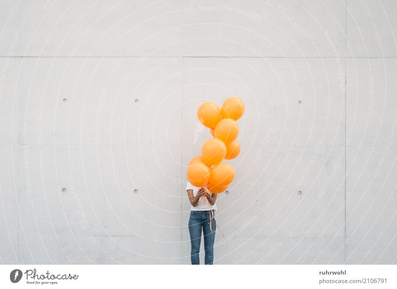 Orange Balloons Feminine 1 Human being 18 - 30 years Youth (Young adults) Adults Hope Freedom Colour photo Exterior shot Copy Space left Copy Space right