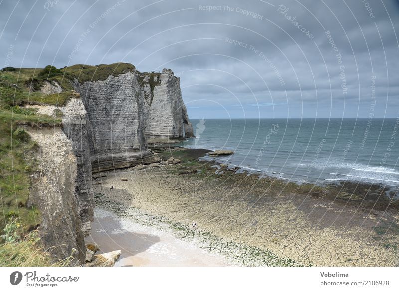 Coast near Etretat in Normandy Nature Landscape Water Sky Clouds Rock Waves Ocean Blue Brown Gray Green Black White Colour photo Exterior shot Deserted