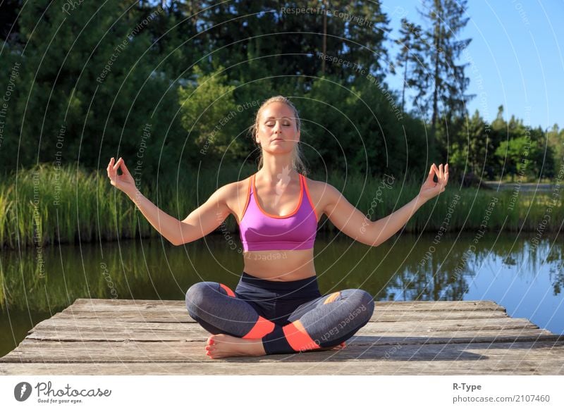 A sporty woman doing yoga and stretching exercises - a Royalty Free Stock  Photo from Photocase