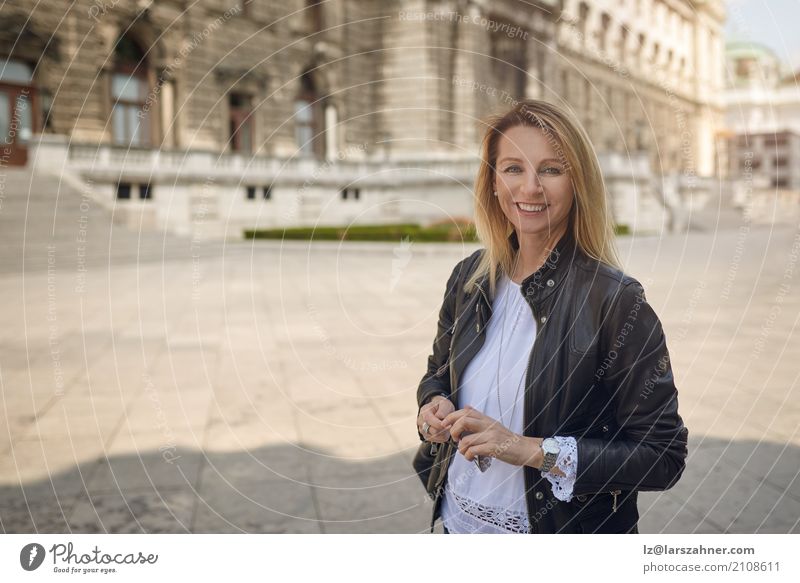 Attractive woman standing in an urban square Happy Face Woman Adults 1 Human being 30 - 45 years Palace Building Blonde Smiling Stand Historic attractive