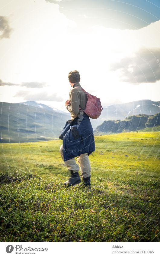 Young man in green Scandinavian mountain landscape Contentment Senses Vacation & Travel Trip Adventure Far-off places Freedom Mountain Hiking