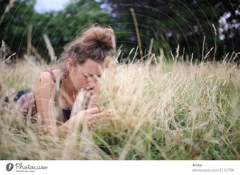 grass whispering Feminine Young woman Youth (Young adults) 1 Human being 18 - 30 years Adults 30 - 45 years Nature Summer Grass Meadow Relaxation Lie Esthetic