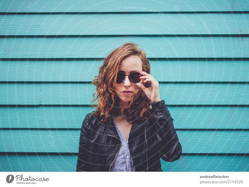 Cool young woman with sunglasses in front of turquoise wooden facade Lifestyle Vacation & Travel Tourism Trip Far-off places Freedom City trip Feminine