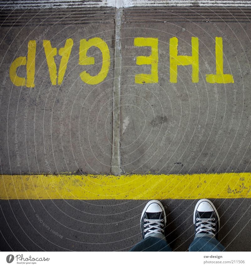 ONE STEP BEYOND Human being Legs Feet 1 Stand Wait Gap Characters Signage Warning label Yellow Colour photo Exterior shot Copy Space middle Day Chucks