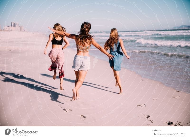 Group of girl friends running at the beach in summer Lifestyle Joy Happy Leisure and hobbies Vacation & Travel Freedom Beach Ocean Human being Feminine
