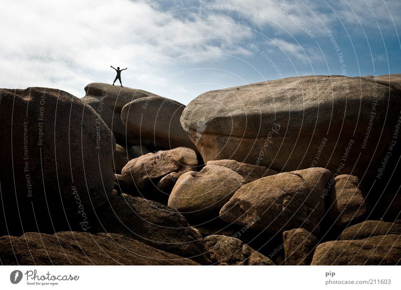 on solid ground Arm Legs 1 Human being Nature Rock Mountain Stone Cool (slang) Free Blue Brown High spirits Freedom Joy Sky Gravel Outstretched Above Peak