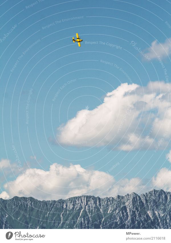 Up in the sky Environment Landscape Beautiful weather Alps Mountain Peak Snowcapped peak Transport Means of transport Aviation Airplane Biplane Airplane landing