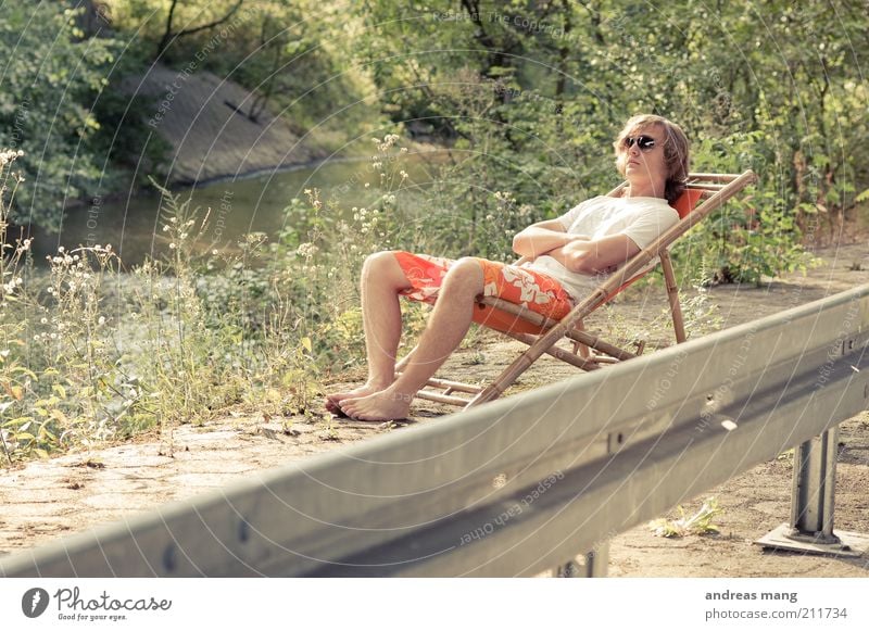 This is where I live | No. 009 Young man Youth (Young adults) Environment Summer Plant Brook Crash barrier Swimming trunks Sunglasses Deckchair Concrete Metal