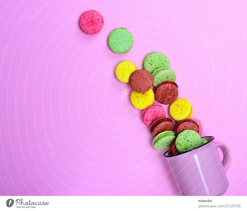 Macarons on a pink background Dessert Candy Cup Mug Gastronomy Eating Bright Delicious Brown Yellow Green Pink Tradition colorful sweet cake Baked goods