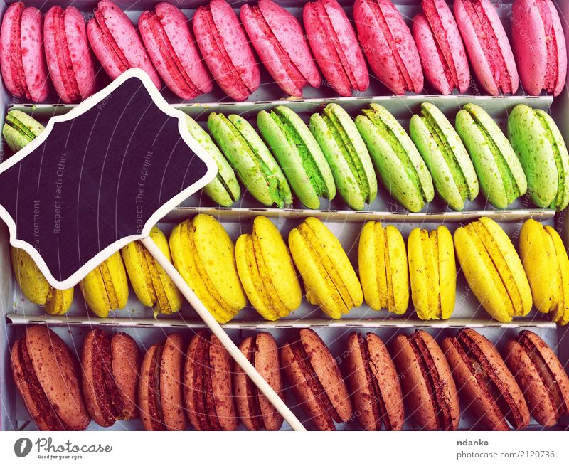 Multicolored biscuits macarons Food Dessert Candy Gastronomy Box Wood Eating Bright Delicious Brown Yellow Green Pink Black Tradition colorful background