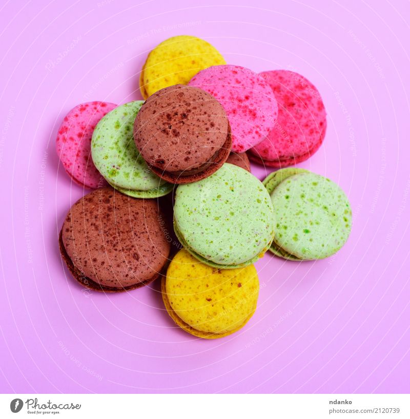 multicolored macarons Dessert Candy Gastronomy Bright Delicious Brown Yellow Green Pink Tradition colorful background Macaron sweet cake Baked goods biscuits