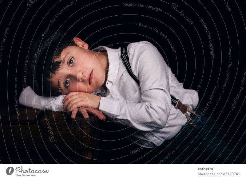 Pensive boy on black background Lifestyle Human being Masculine Child Toddler Boy (child) Infancy 1 3 - 8 years Cap Think Lie Sleep Sadness Gloomy Emotions