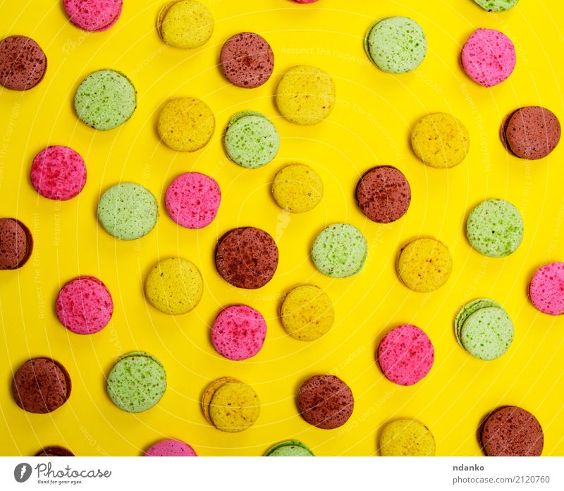 Colorful pastry macarons Dessert Candy Gastronomy Eating Bright Brown Multicoloured Yellow Green Pink Tradition colorful background Macaroni sweet cake